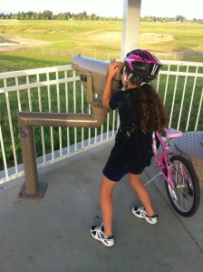 Gigi trying to spot one of the migrating birds on our bike ride...