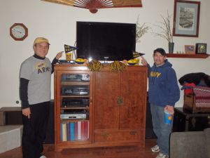 Jerry and Jason rooting for perennial winner Navy during the Army-Navy Football game in 2013